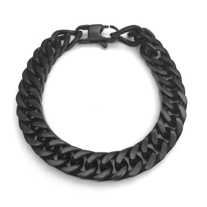Detail view of bold black stainless steel curb chain bracelet with industrial clasp