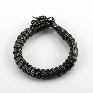 Detailed close-up of dragon scale bracelet with 316L stainless steel engraving