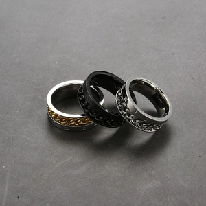 Three-piece stainless steel spinning rings with Roman numerals and curb chain inlay