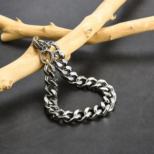 Silver cuban chain bracelet for men in stainless steel displayed on a natural wood piece