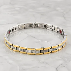 Magnettherapie-Armband aus Edelstahl mit Gold-Silber-Gliedern und Rändelstruktur