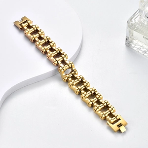 Detailed close-up of golden industrial bike chain style stainless steel bracelet for men
