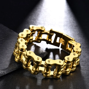 Detailed macro view of a gold biker chain bracelet for men with mechanical links
