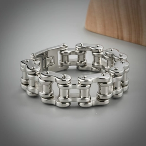Detailed close-up of heavy mechanical chain bracelet in polished stainless steel for men