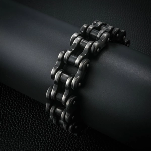 Macro shot of industrial motorcycle chain bracelet in antique grey stainless steel