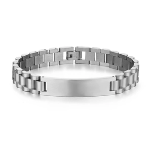 Detailed macro view of silver stainless steel ID bracelet with link band and brushed finish