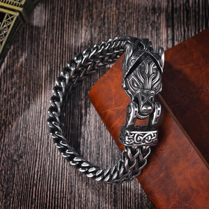 Detail of vintage Viking wolf head bracelet with heavy stainless steel braided chain