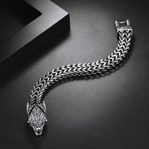Detail shot of vintage stainless steel Viking wolf head bracelet with double-row curb chain