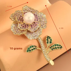 Detail view of flower brooch with colorful cubic zirconia, pearls, and size dimensions