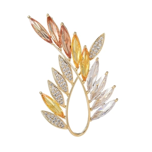 Elegant olive branch brooch with colorful crystals and cubic zirconia in gold plating