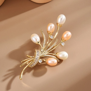 Elegant gold flower bouquet brooch with freshwater pearls and sparkling cubic zirconia crystals