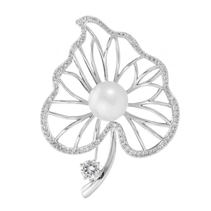 Elegant leaf brooch with white pearls and sparkling zircons set in silver metal frame