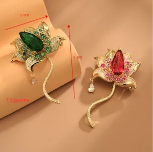 Macro detail of gold lotus brooch with zircon stones measuring 3.8 cm by 5.9 cm