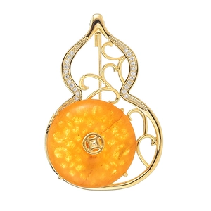 Elegant zircon gourd brooch with amber honey stone and golden coin detail on white background