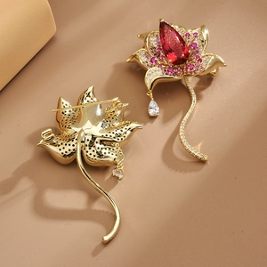 Elegant gold lotus brooch with red pear-shaped zircon and pink sparkling petals