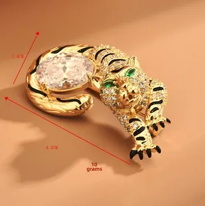 Detailed view of luxury tiger brooch showing 4.3cm by 2.4cm dimensions and golden finish