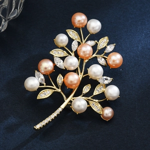 Exquisite branch brooch with freshwater pearls and sparkling zircons on blue velvet