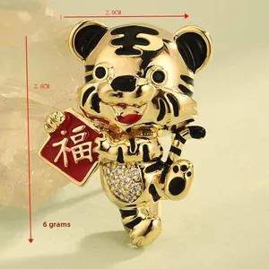 Detailed view of tiger brooch with gold finish, enamel stripes and dimensions 2.8x2.0 cm