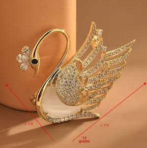 Detailed swan brooch dimensions 4.2cm by 4.8cm with micro-pave cubic zirconia crystals