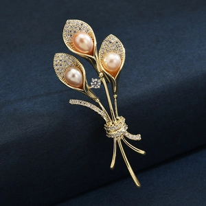 Elegant gold morning glory brooch with pink freshwater pearls and shimmering cubic zirconia
