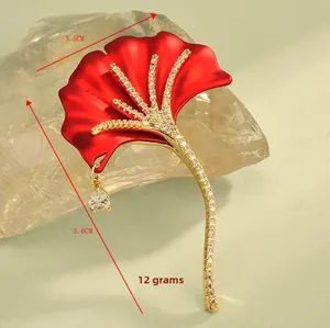 Detail of red ginkgo leaf brooch with crystals and teardrop pendant, size 3.5cm by 5.6cm