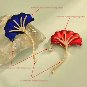 Detail of ginkgo leaf brooches with micro-set zirconia and teardrop crystal pendants