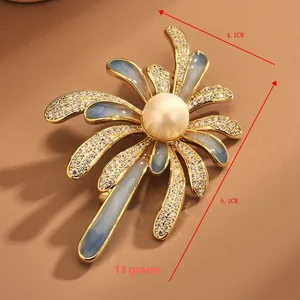 Detail view of gradient enamel flower brooch with pearl and crystal, size 4.1cm x 6.1cm