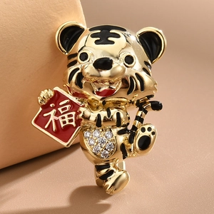 Chinese zodiac tiger brooch with gold alloy, red enamel fu plaque and sparkling crystals