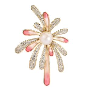 Radial brooch with pink gradient enamel, faux pearl center, and sparkling zircon accents