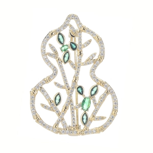 Gilded gourd brooch with micro-paved zircons and green bamboo leaf stones on white base