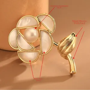 Macro detail of mother of pearl rose brooch with freshwater pearl and gold polished copper