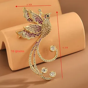 Detailed view of golden phoenix brooch with purple crystals and 6.2cm height specifications