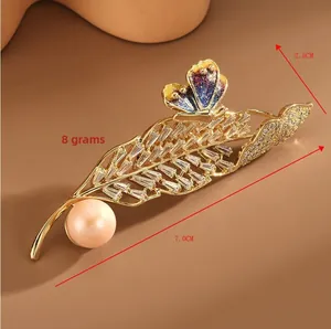 Detail view of leaf brooch with dimensions 7.0cm by 2.5cm and 8g weight specification