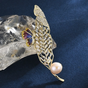 Elegant gold hollow leaf brooch with sparkling zircons, pink pearl, and colorful butterfly