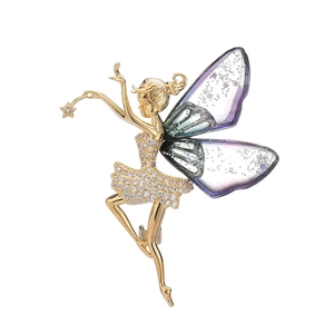 Exquise broche de danseuse aux ailes d'ange dorée avec zircons et ailes violettes