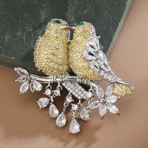 Elegant bird brooch with yellow zircon and sparkling water drop gemstone pendants