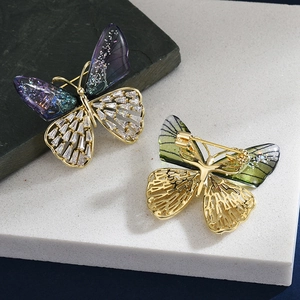 Elegant crystal butterfly brooch set in gold finish with purple gradient and zircon inlay