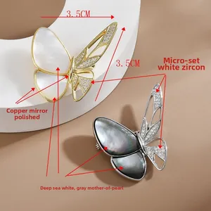 Detailed close-up of 3.5cm butterfly brooch featuring white zircon and mother of pearl