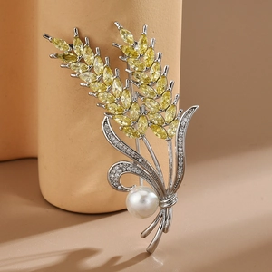 Elegant wheat ear brooch with yellow zircons and white pearl on silver base