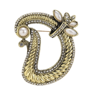 Elegant gold-tone letter D brooch with pearls and rhinestones on white background