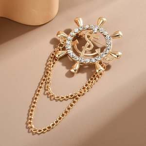 Golden helm brooch with rhinestones and elegant hanging chains for suits
