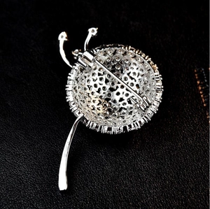 Exquisite silver beetle brooch with white zircon pavé and hollow carved design details