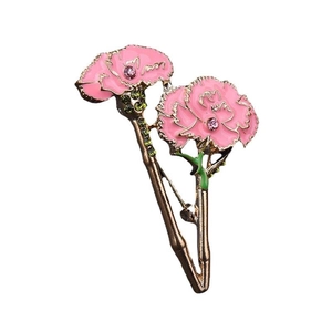 Elegant pink enamel carnation brooch pin with gold plating and green zircon accents