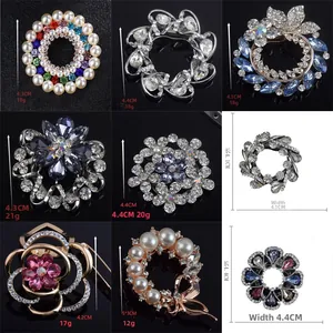 Detailed view of alloy flower brooches with crystals, pearls, and size measurements