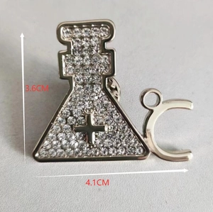 Detail shot of rhinestone lab beaker brooch with size measurements 3.6cm by 4.1cm