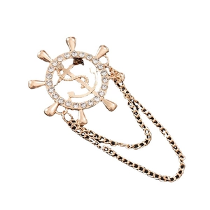 Elegant gold rudder and anchor brooch with sparkling rhinestones and layered hanging chains