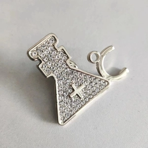 Elegant laboratory flask and stethoscope brooch with silver metal and sparkling crystals