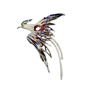 Élégante broche phénix avec émail coloré et cristaux blancs en position de vol