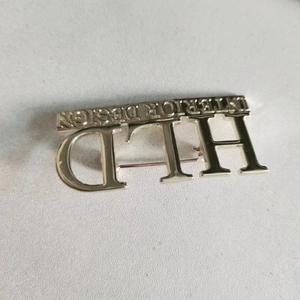 Silver HLD Interior Design metal brooch pin for women's jackets and fashion accessories