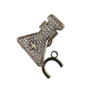 Sparkling silver chemistry flask brooch with white crystals and cross detail